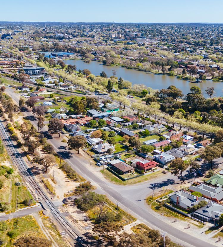 Aerial view of an Australian suburb by a lake